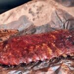 st louis ribs in butcher paper on a traeger grill