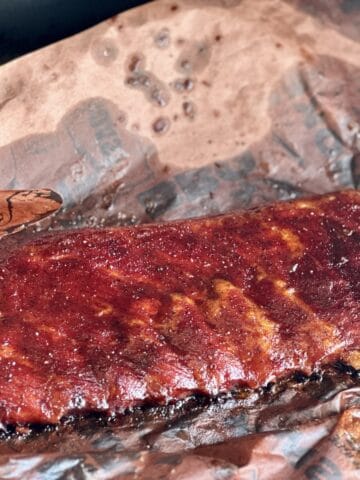st louis ribs in butcher paper on a traeger grill