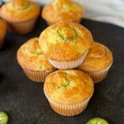 jalapeño cheddar cornbread muffins on black cutting board