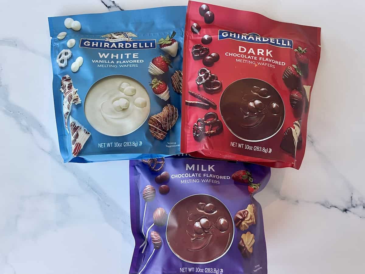 bags of ghirardelli chocolate wafers including white dark and milk chocolate