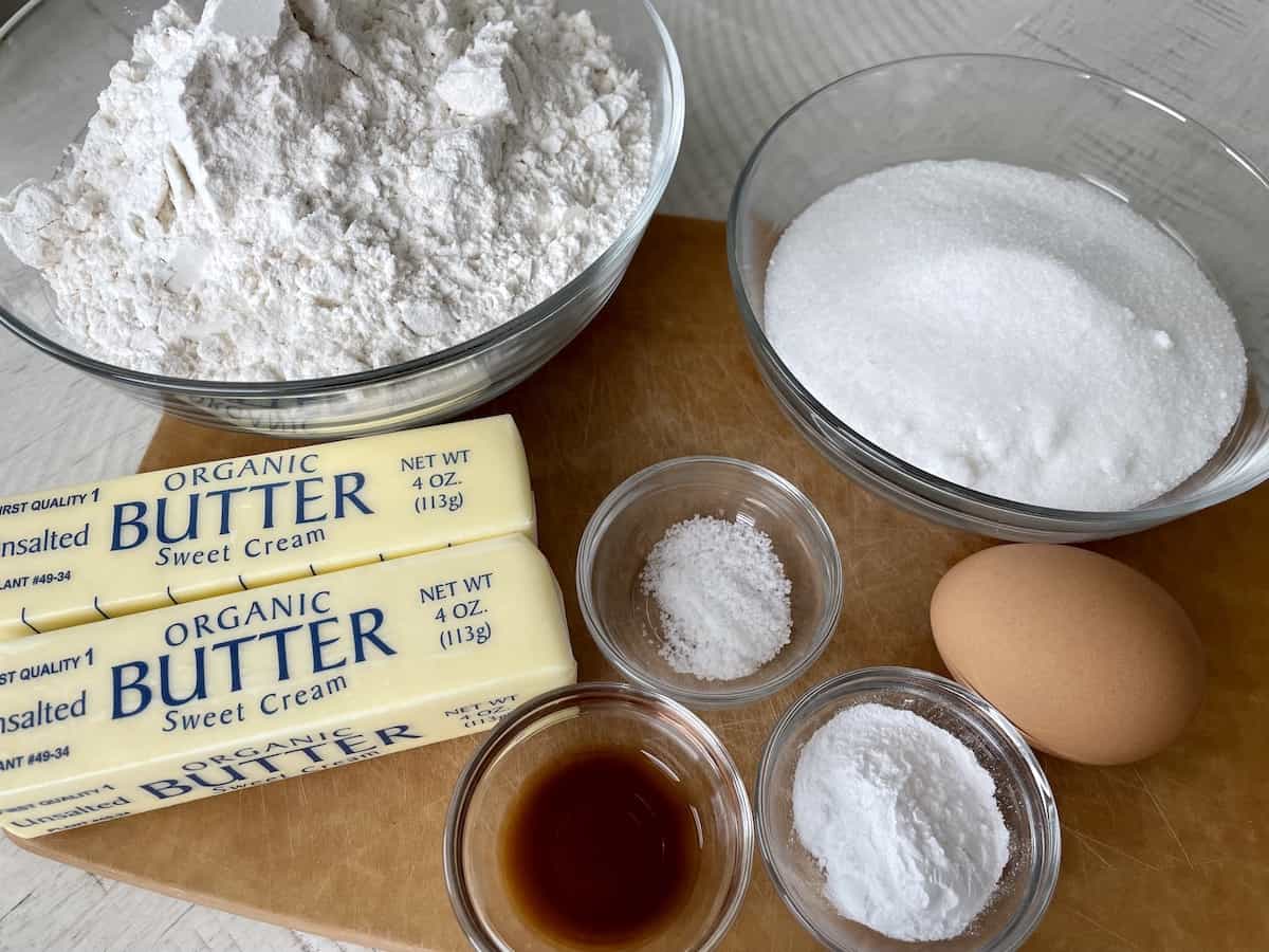 no chill sugar cookie cut out recipe ingredients including all purpose flour in a glass bowl two sticks of unsalted butter salt vanilla extract sugar one egg and baking powder