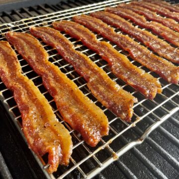 cooked bacon jerky on in a traeger grill turned bright red from the smoking process