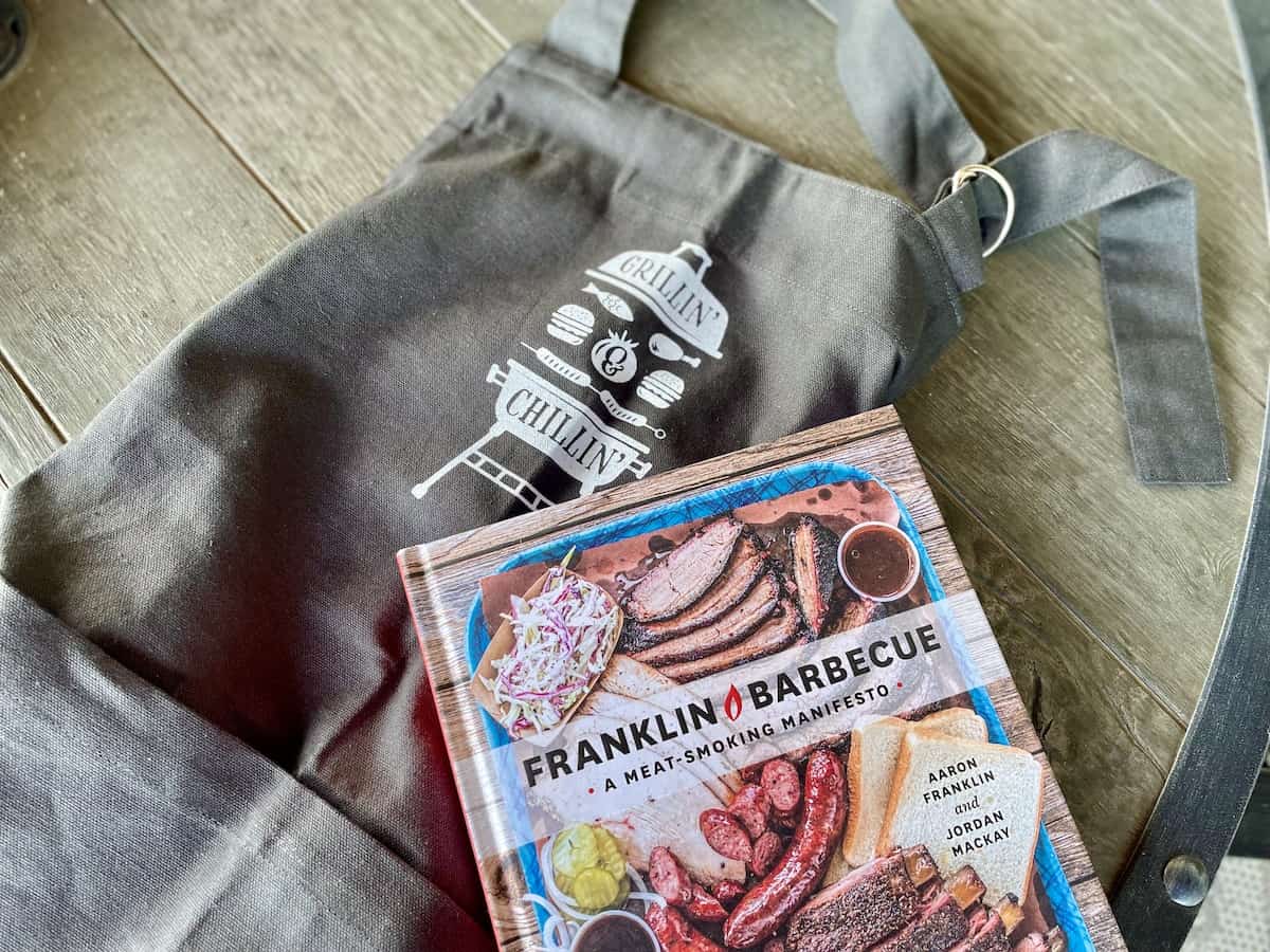 grey grilling apron and Franklin bbq cookbook