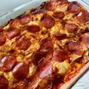 large glass bake dish with cooked pizzagna recipe