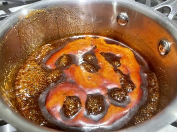 Jack Daniels sauce simmering in a medium sauce pan