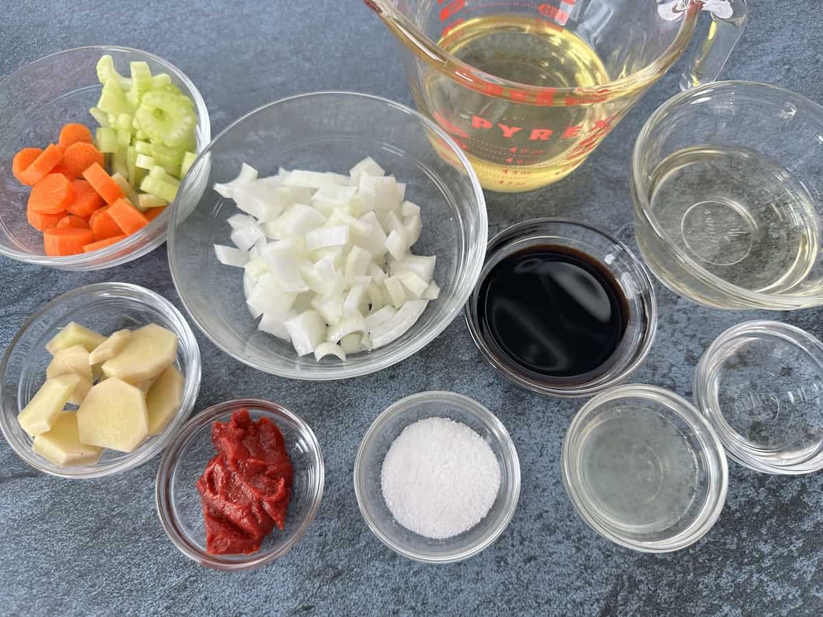 ginger salad dressing ingredients measured out in glass bowls