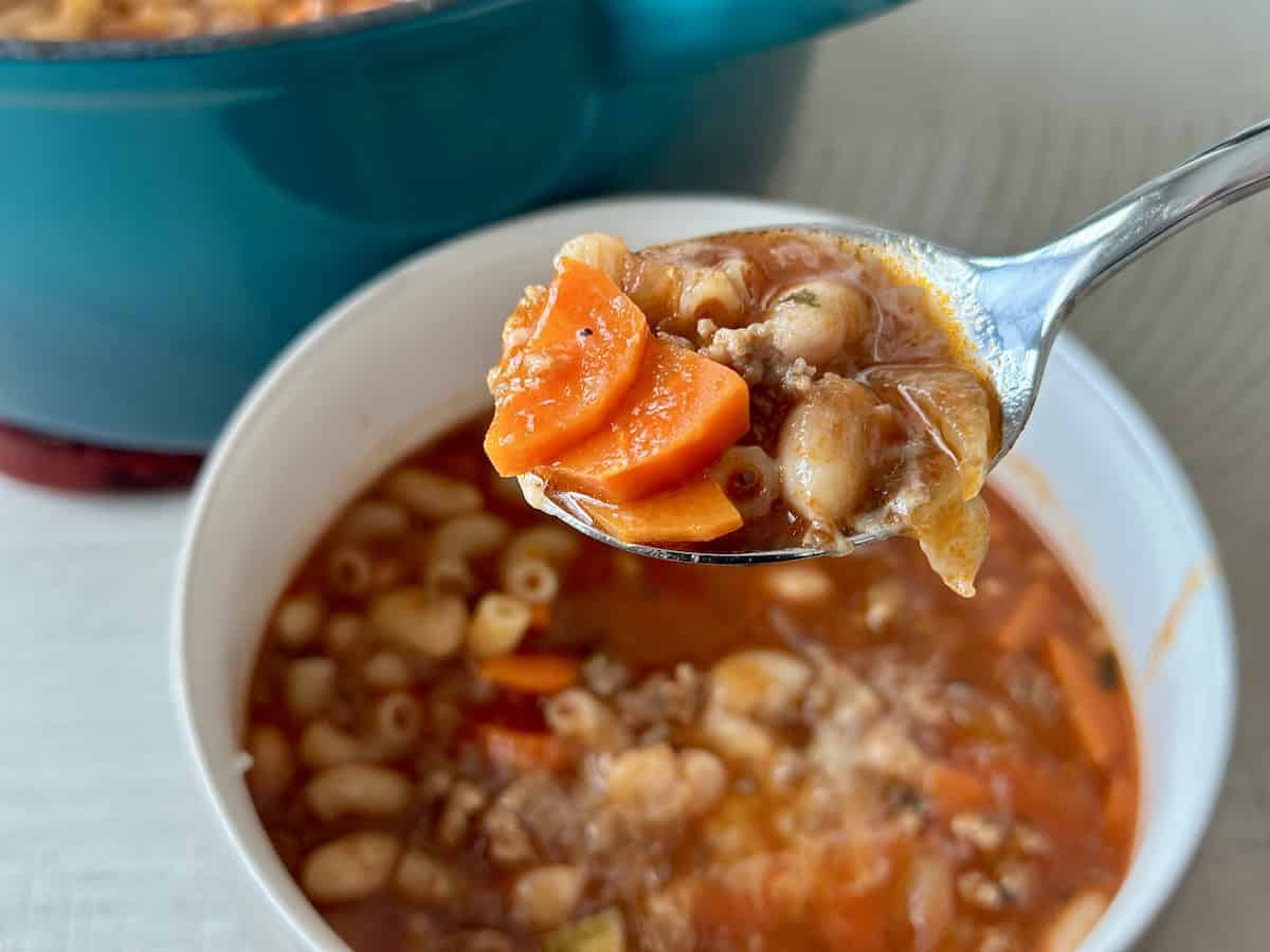 gluten free pasta e fagioli soup with white bowl soup spoon teal pot