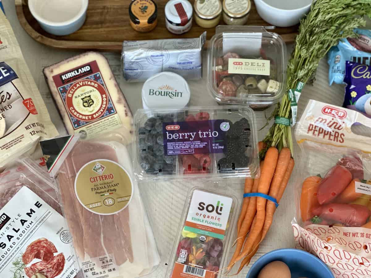 charcuterie board items in packaging on white table