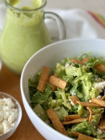 Mexican caesar salad with dressing and tortilla chips