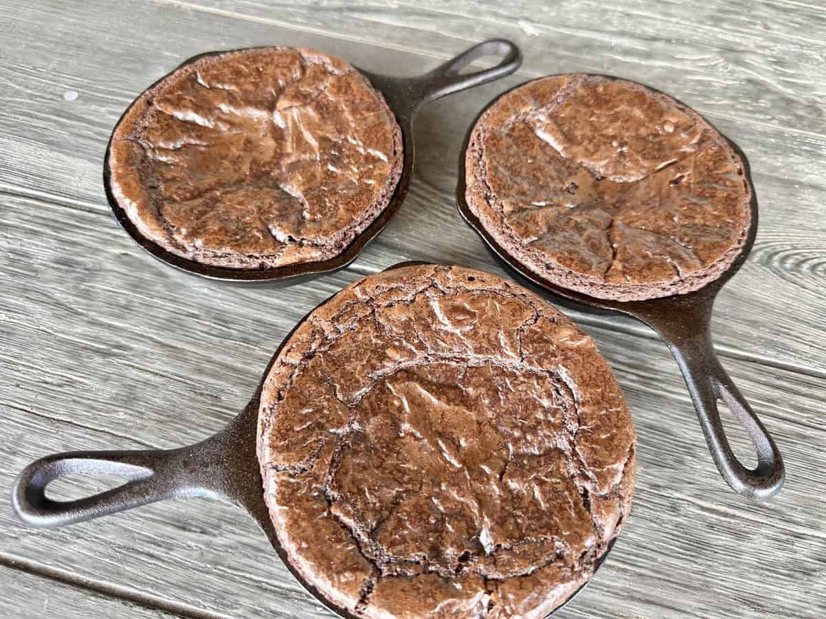 3 brownie skillets on wood table