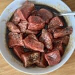 white bowl of steak and basic meat marinade