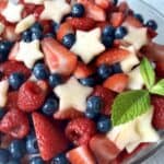 apple stars raspberries strawberries and blueberries in bowl