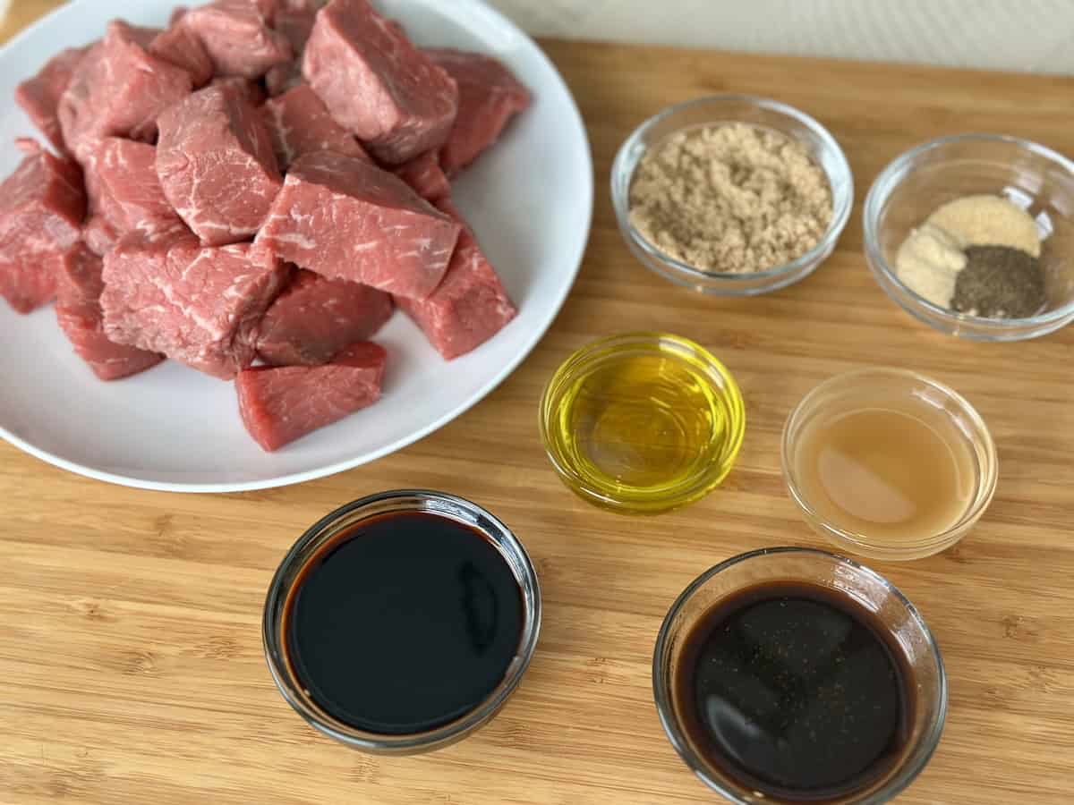 cubed sirloin next to marinade ingredients