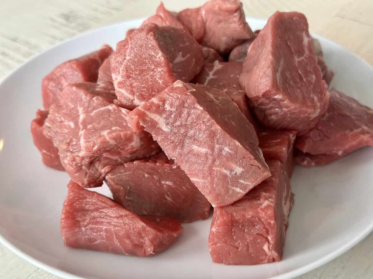 cut sirloin on white plate