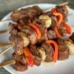 grilled traeger steak kabobs on white plate