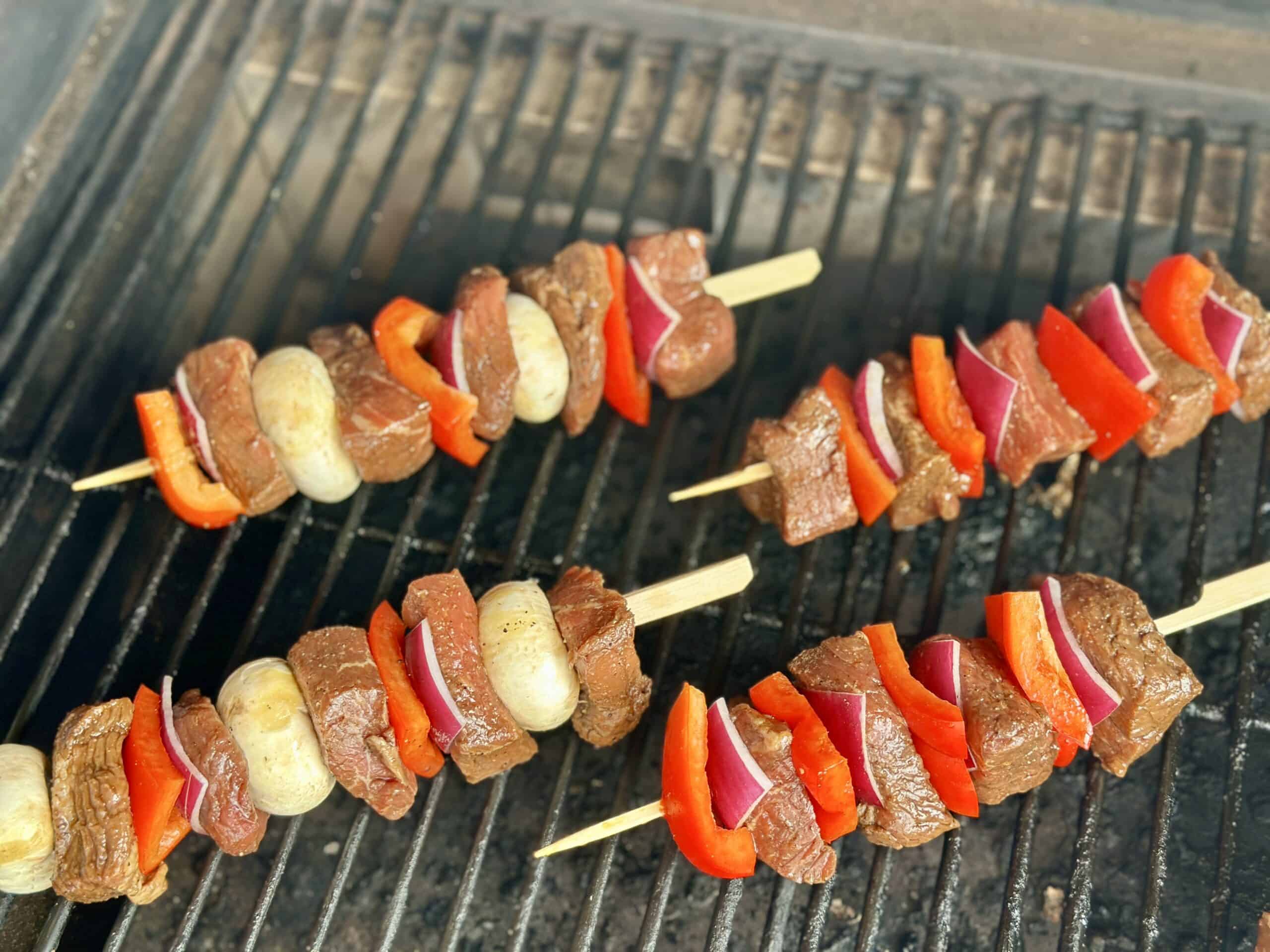 4 beef skewers on traeger grill grates