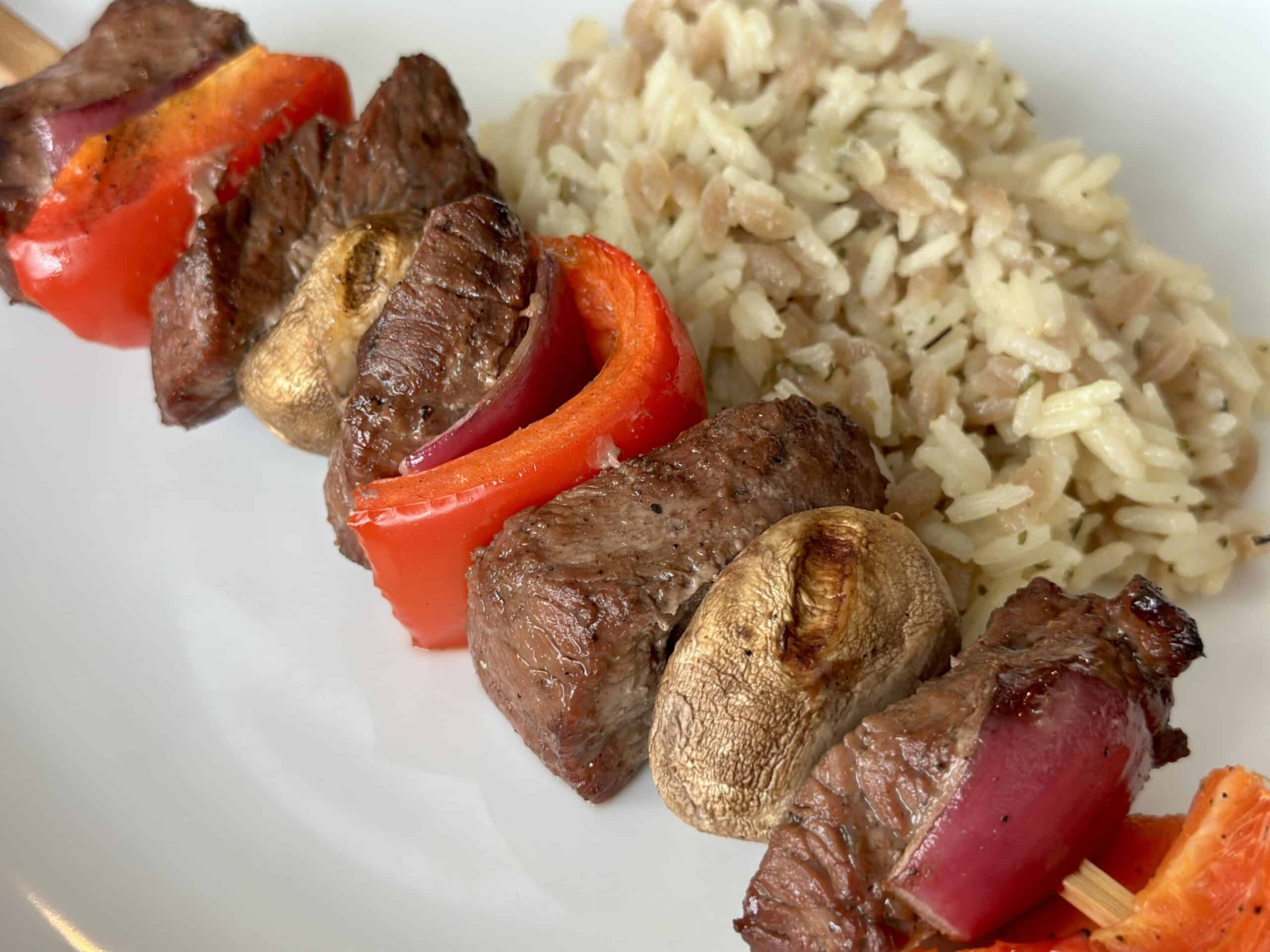 traeger steak kabob on plate with rice pilaf
