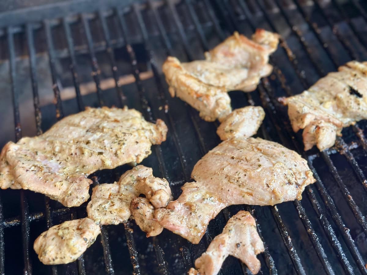 grilled chicken thighs on grill grates