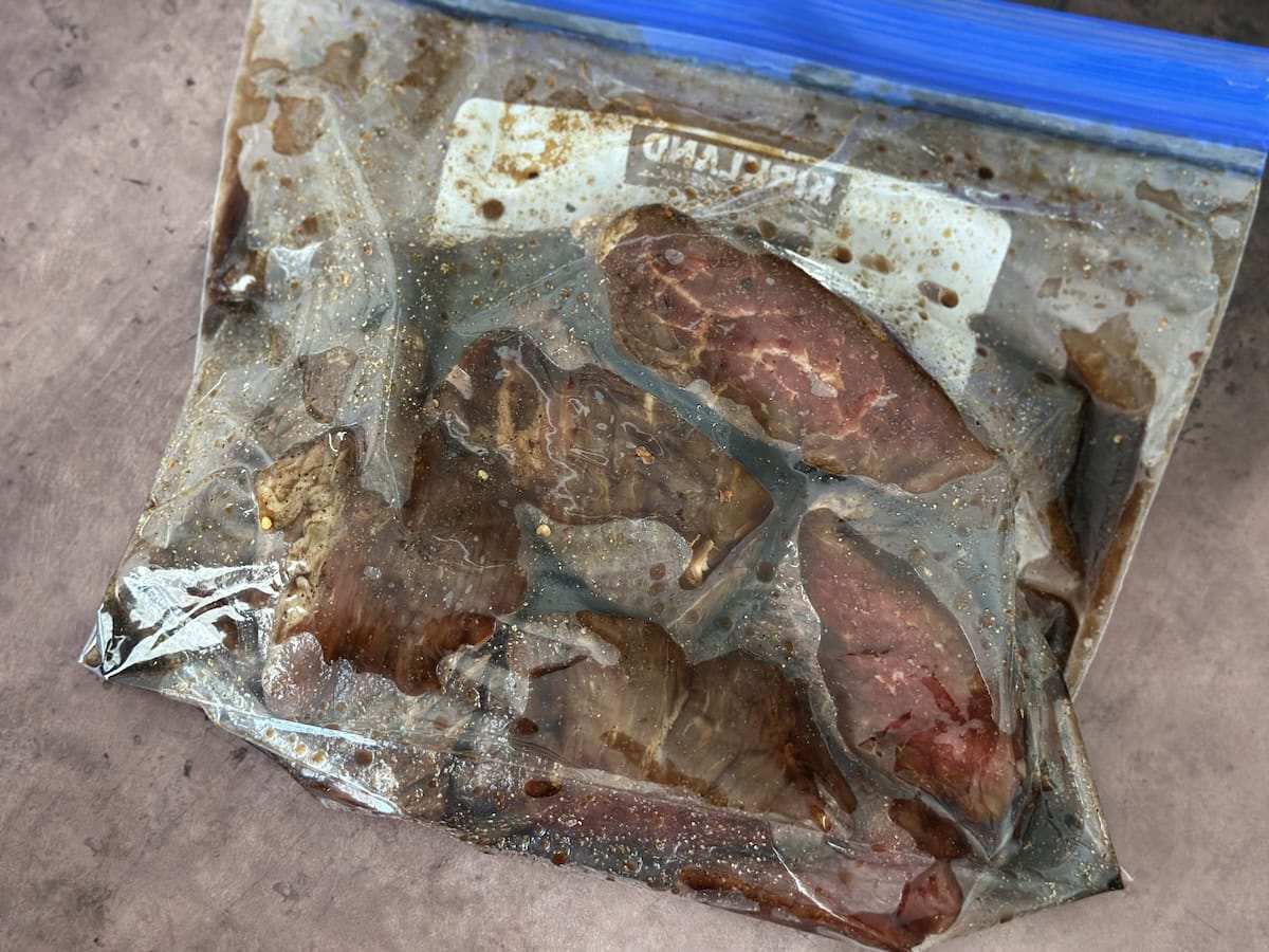 steaks marinating in sip top bag