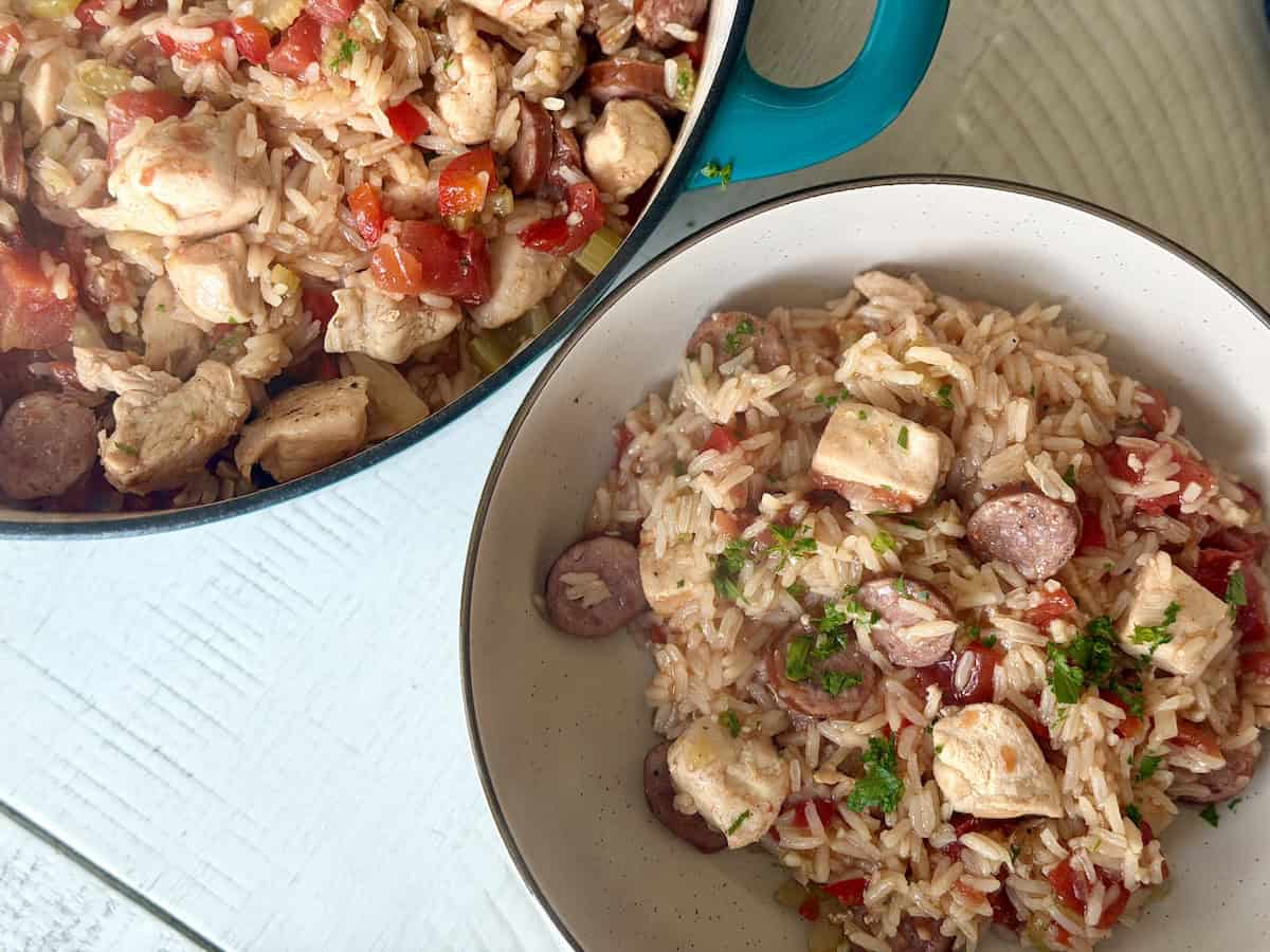 teal pot with jambalaya next white bowl of jambalaya