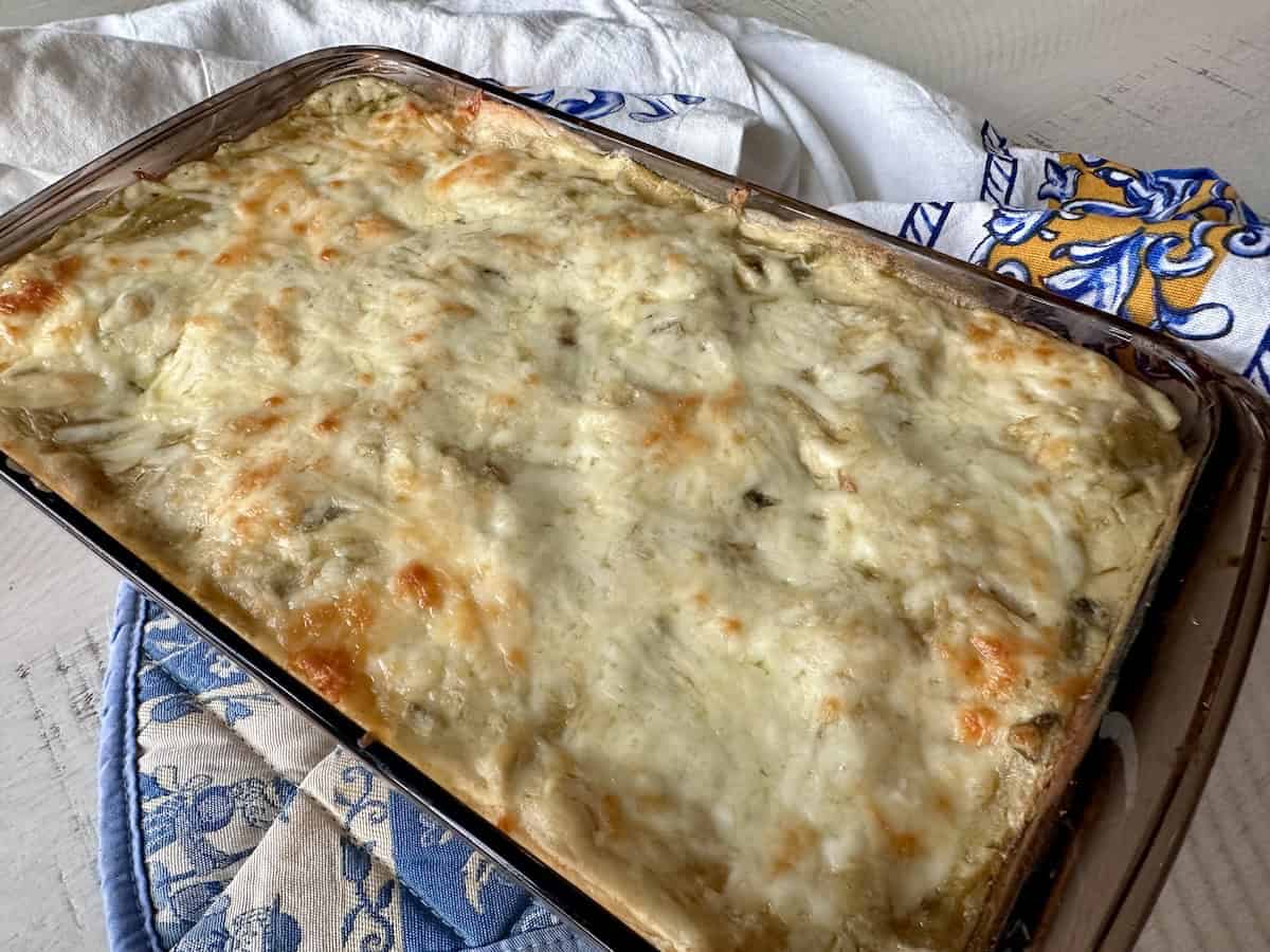 cooked casserole on table with apron