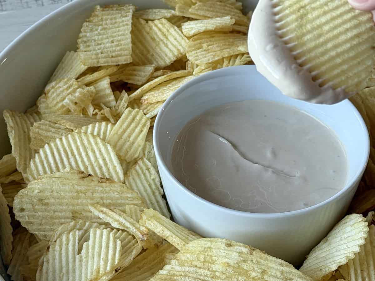 ruffle potato chip dipped on onion dip