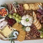 thanksgiving themed charcuterie board grapes cheeses meats and candy