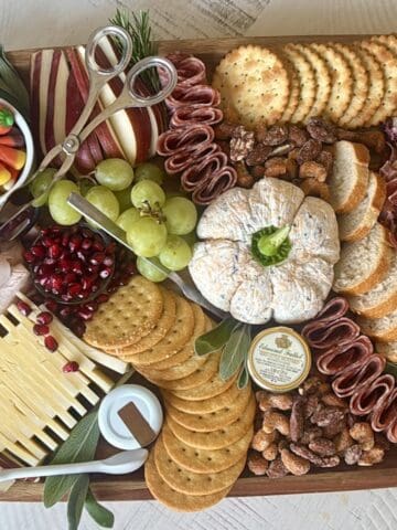thanksgiving themed charcuterie board grapes cheeses meats and candy