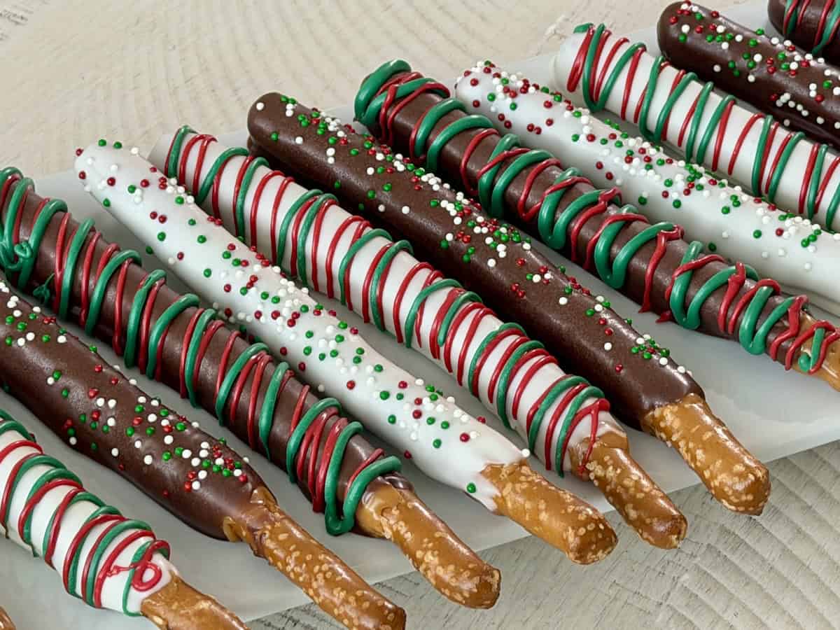 christmas pretzel rods on white plate