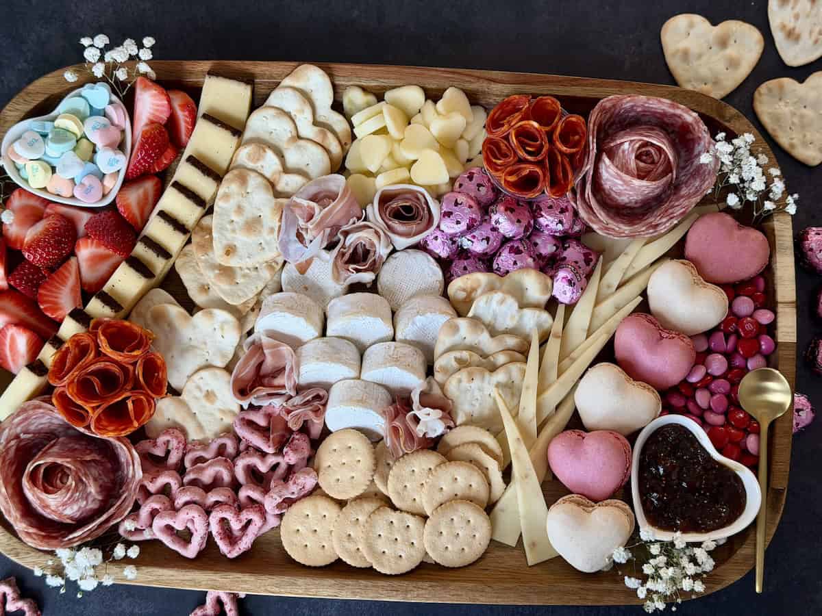 assembled valetine's day charcuterie board black backround