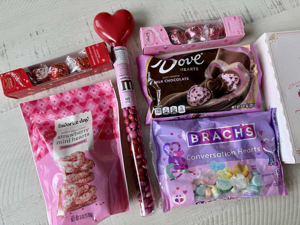 valentine candy and heart pretzels on white kitchen table