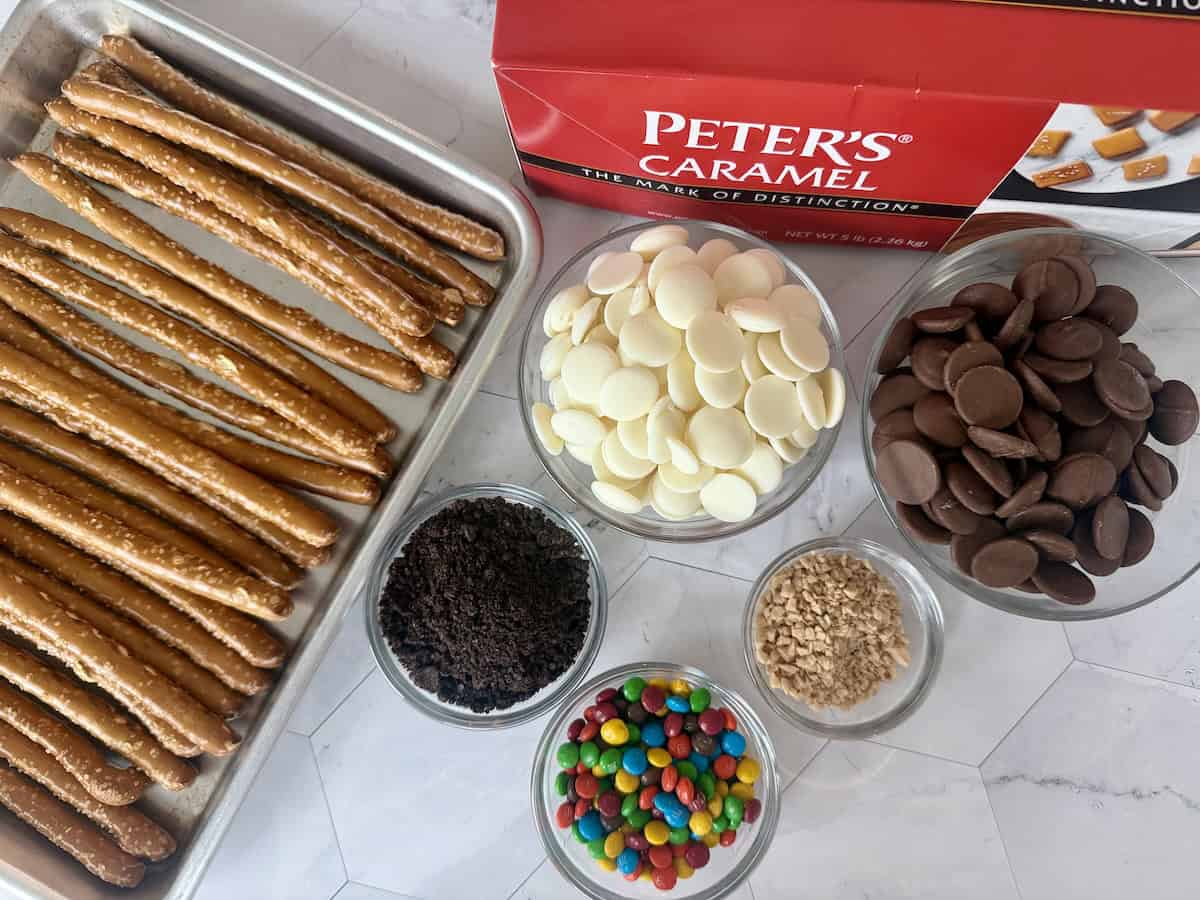 pretzel rods on sheet pan boxed Peters caramel bowls of chocolate toppings