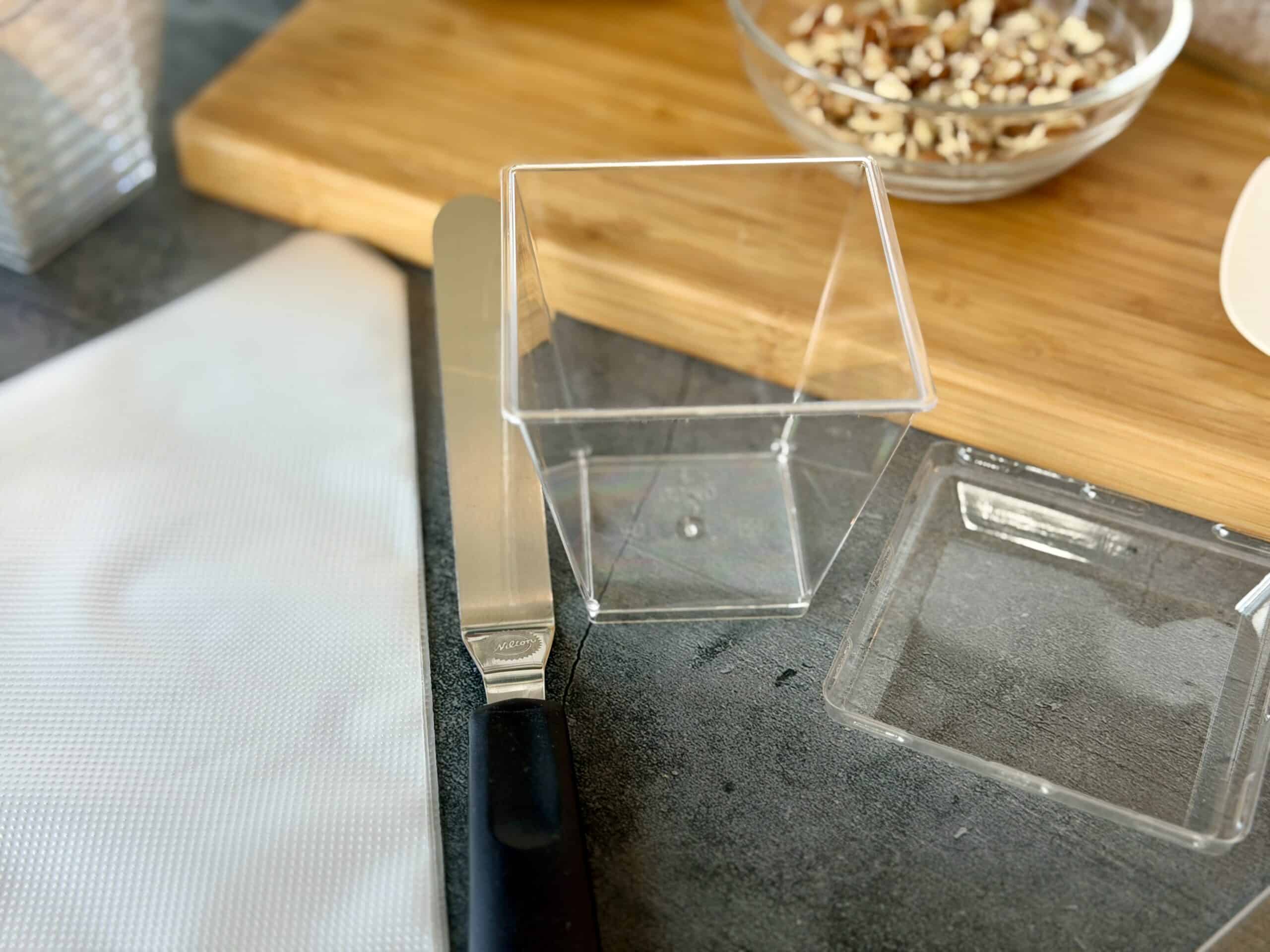 clear 8 ounce plastic cup small offset spatula disposable piping bags wood cutting board