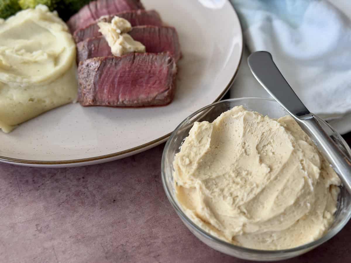 sliced steak topped with miso butter bowl of prepared butter mashed potatoes