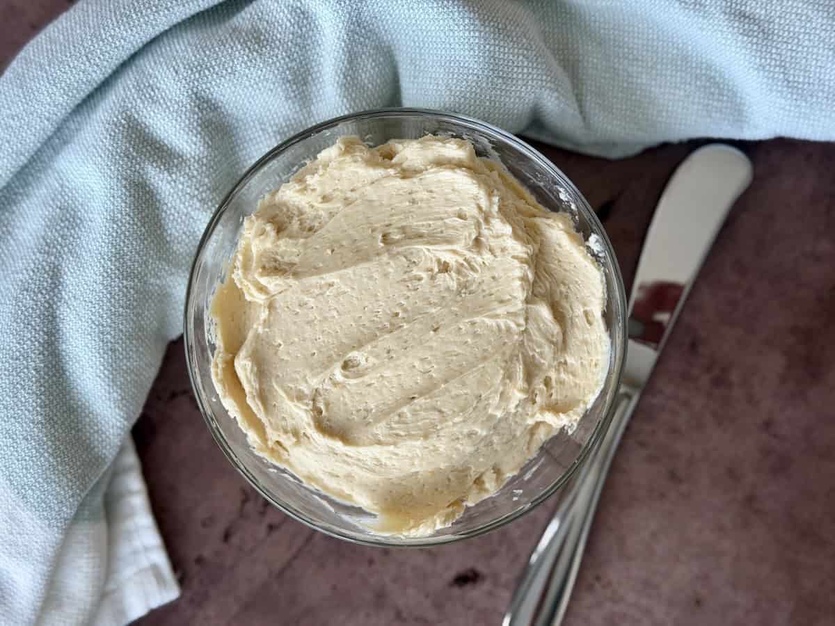 miso butter in glass bowl butter knife green kitchen towel
