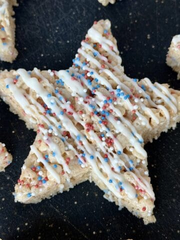 star shaped Rice Krispie treat with white chocolate and sprinkles
