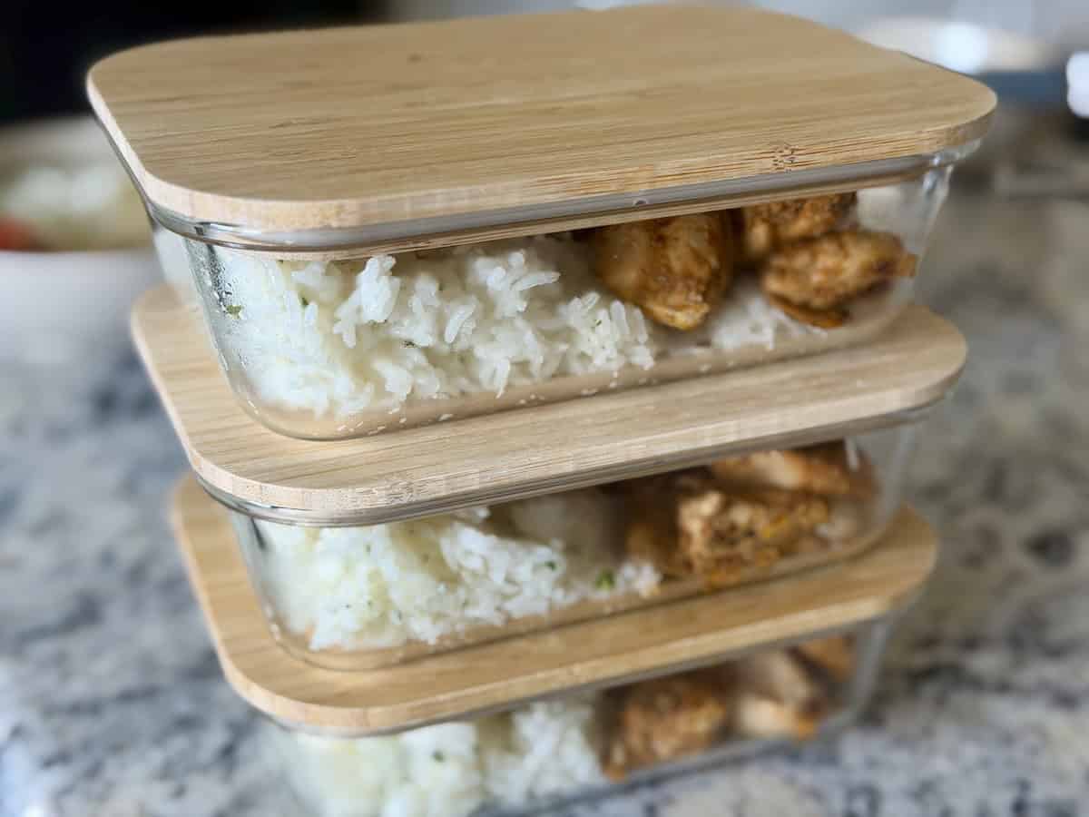 3 glassware containers with leftover chicken and rice