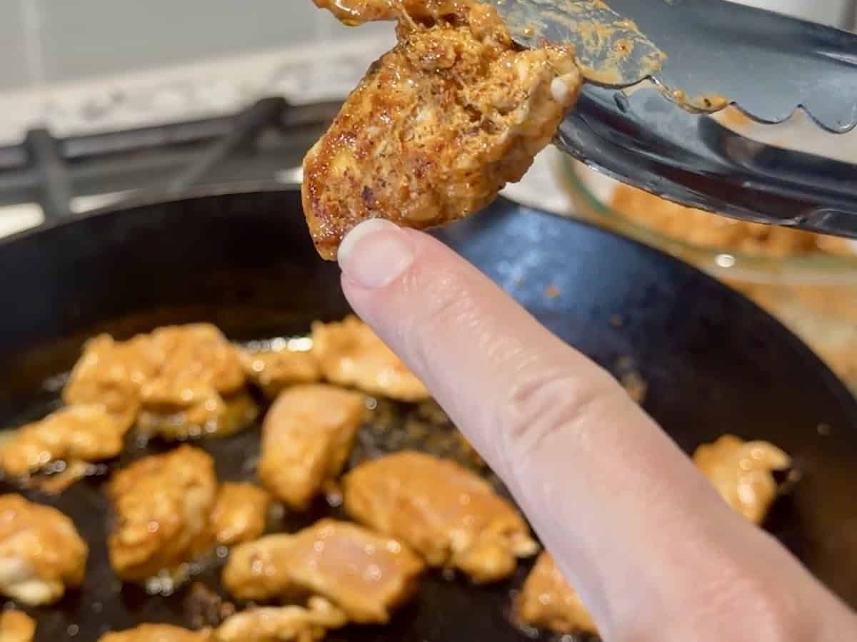 chipotle chicken cooking in a cast iron skillet
